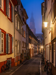 Fototapeta na wymiar Small street at night in the historic old town, Heidelberg, Germany