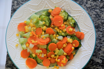 salvador, bahia, brazil - april 29, 2023: smoke rising from a plate with cooked vegetables.