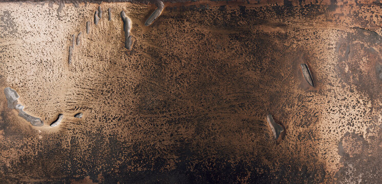 immagine di superficie metallica in bronzo grezzo con imperfezioni, vista dall'alto