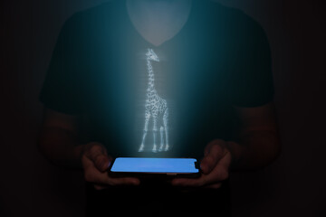 A businessman in the future projecting animals on his mobile phone.