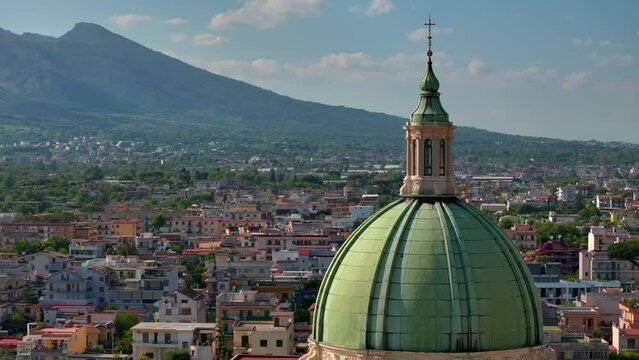 Towards Blessed Virgin Of The Sacred Rosary Sanctuary, Church in Bartolo square in Pompeii, Pontifical Shrine of the Blessed Virgin of the Rosary Vesuvius volcano crater next to Naples volcano Mount