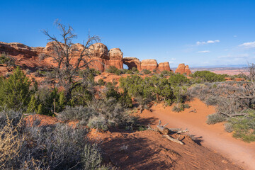 hiking the broken arch trail in arches national park, utah, usa