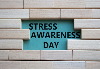 Stress Awareness Day symbol. Wooden blocks with words Stress Awareness Day. Beautiful grey green...