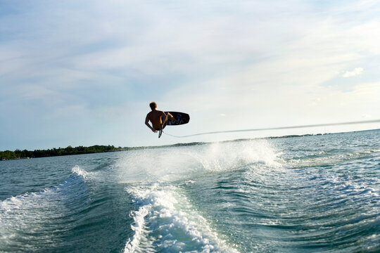 man kite surfing at ocean