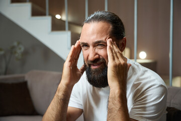 Middle-aged male suffers from a headache