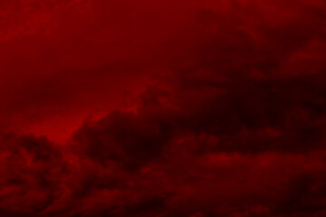 Dark red smoke cloudy background. Blurred photo of dark red sky. Photo can be used for the concept...