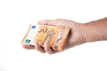 Man's hand holding euro banknotes isolated on a white background.