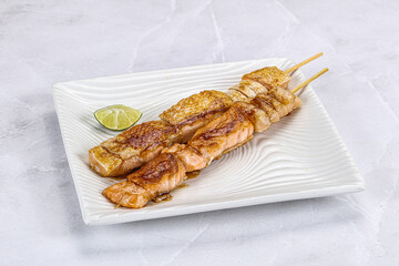 Grilled salmon skewer with sauce
