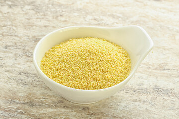 Raw couscous in the bowl