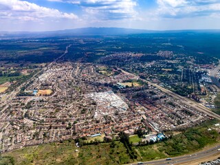 Aerial view of residential areas, garden plots, highways and buildings in south Nairobi, Kenya,...