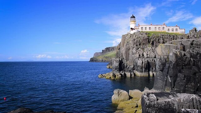Neist Point Lighthouse high on basalt cliffs at the most westerly point on the Isle of Skye, Scotland landmark, UK