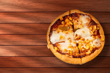 Corn pizza on wooden table background. Top view with copy space