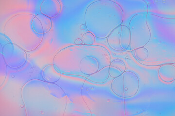 Iridescent colorful abstract background with bubbles, fluid texture pastel tones curvy wavy good vibes