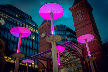 purple lights at a train station