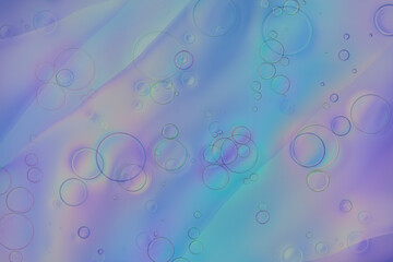 Iridescent colorful abstract background with bubbles, fluid texture pastel tones curvy wavy good vibes