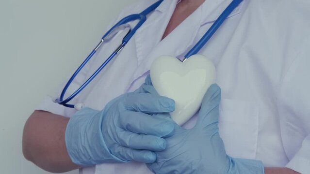 female scientist, doctor holding heart model, health medical technology, diagnosis and treatment heart disease, medical humanism concept, cardiology, intensive care, resuscitation