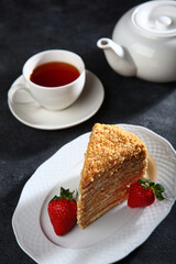 Slice of honey cake on plate. Copy space. Selective focus.Vertical photo.