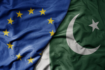 big waving realistic national colorful flag of european union and national flag of pakistan .