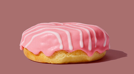 Pink donut with glaze on pink pastel background