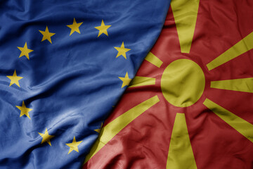 big waving realistic national colorful flag of european union and national flag of macedonia .