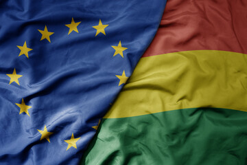 big waving realistic national colorful flag of european union and national flag of bolivia .