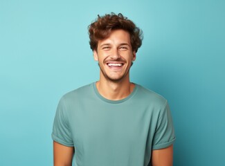 Obraz premium Beautiful man against blue background