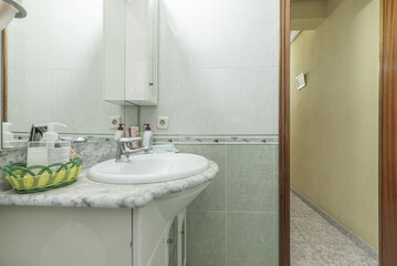 Conventional bathroom complete with washbasin cabinet with mirror and integrated lighting