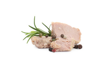 Delicious canned tuna chunks with rosemary and peppercorns isolated on white