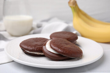 Tasty sweet choco pies on table, closeup