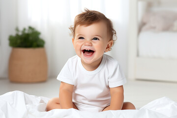 Fototapeta premium Smiling happy child. Portrait Of Adorable Little Kid Wearing Bodysuit Resting In Bedroom, Copy Space