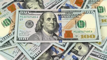 American banknotes value of 100 dollars Us, rotate. Close-Up of banknotes. Cash hundred dollar bill money close up in camera motion.  - Powered by Adobe