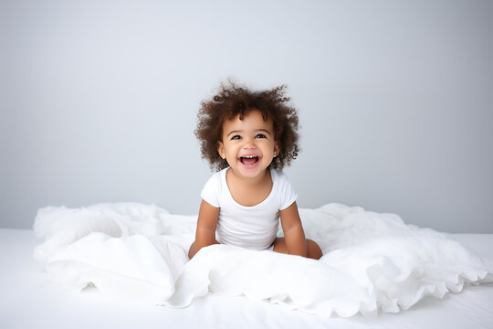 Smiling happy child. Portrait Of Adorable Little African American Infant Kid Wearing Bodysuit Resting In Bedroom, Copy Space
