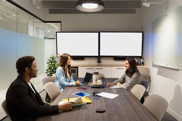 Group of smiling business people working in modern office, talking, cooperation, sharing ideas