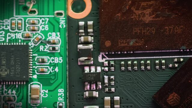 Microchips top view, CPU processor. Computer motherboard components. PC chip close up, slowly tracking shot.