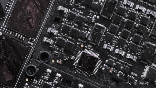 Microchip and microprocessors, anxious glowing blue glare. Computer PC chip blue light, close up. Computer motherboard components.