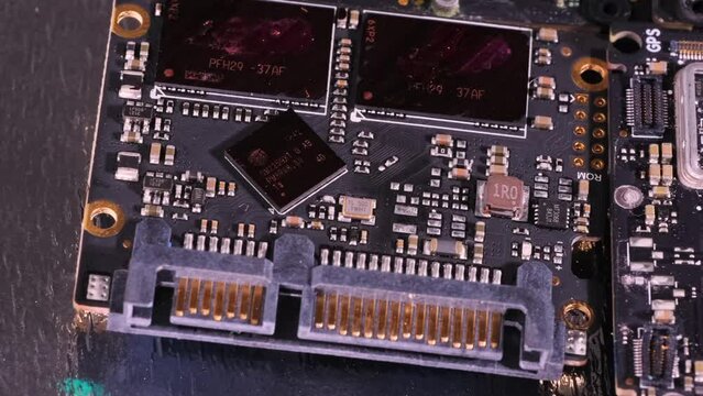 Microchip and microcircuit, tracking shot, increase macro close up, top view. Computer PC chip. Computer motherboard components.