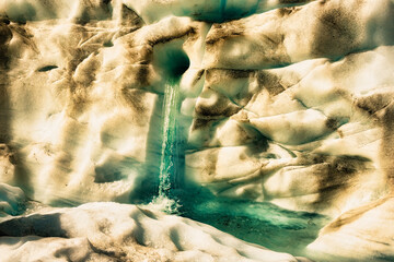 Flying by helicopter to the glacier and then Heli hiking on the glacier floor high up in the...