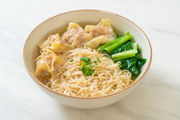egg noodles with pork wonton soup or pork dumplings soup and vegetable