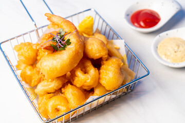 Fried seafood platter with sauce