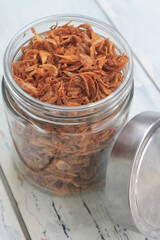 Fried onions in a jar on the table