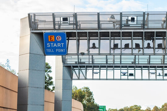 E-Toll tag point start on motorway entry with sign and cameras