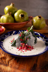 Chile en Nogada, Typical dish from Mexico. Prepared with poblano chili stuffed with meat and fruits and covered with a walnut sauce. Named as the quintessential Mexican dish for national holidays.