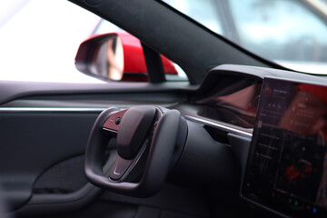 Interior of a prestigious modern black car. accessories and steering wheel.