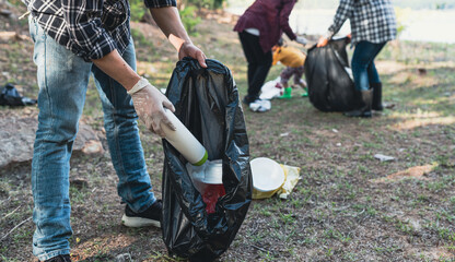environmental protection Pollution and global warming problems Volunteers collect plastic bottles,...