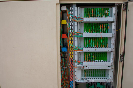 fiber network street box landline telephone wires switchboard electrical communication junction box with binding posts and wires for DSL in city street