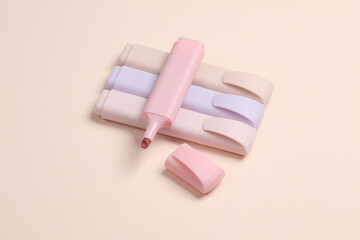 Markers or colored felt-tip pens on beige pastel background. Creative layout