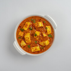Spicy paneer tikka masala in white bowl on whtite background , image