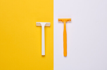 Yellow and white razors on yellow white background