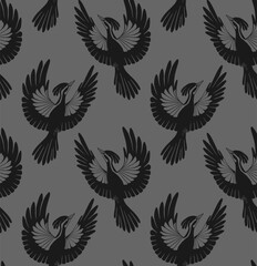 Fototapeta na wymiar Seamless vector pattern of flying woodpeckers silhouettes. Dark texture with black stylized bird on gray background. Surface design