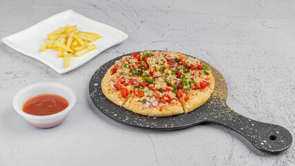 delicious pizza on pan with fries and sauce on texture white background